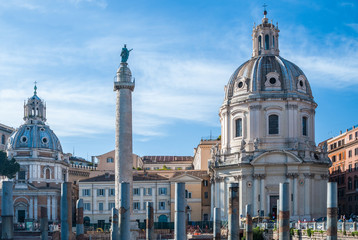 Fototapeta na wymiar View of Trajan's Forum, Trajan's Column, Church of the Most Holy Name of Mary and Church of Madonna di Loreto