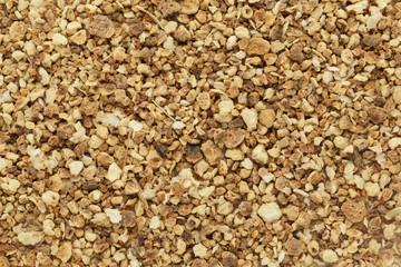 Organic dry sweet orange (Citrus sinensis) tea cut seeds. Macro close up background texture. Top view.