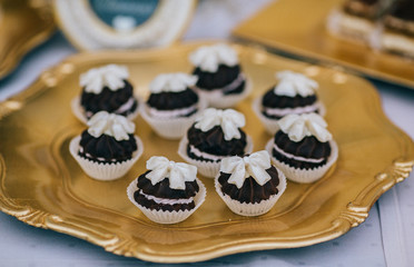 French macaroons on a cake stand . Candy bar on wedding.