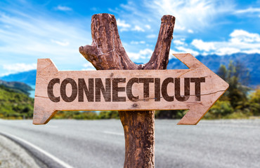 Connecticut wooden sign with road background