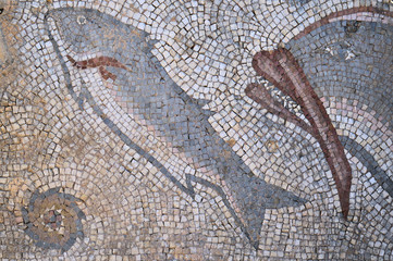 Antique Roman mosaic with sea life motifs located at the archaeological site of Milreu, in Estoi, Algarve, Portugal