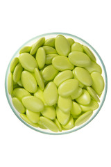 Green candy jar decorated against isolated on white background