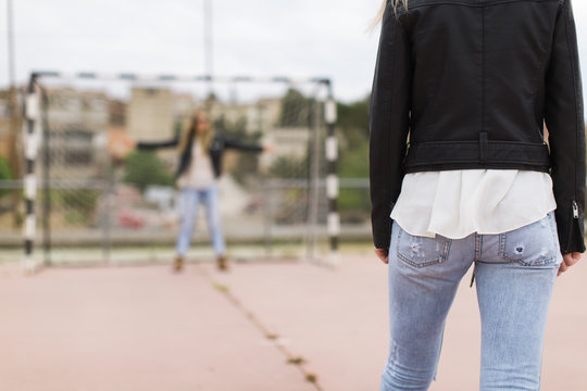 Two women on sports field