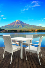 White dining table on lake and mountain background