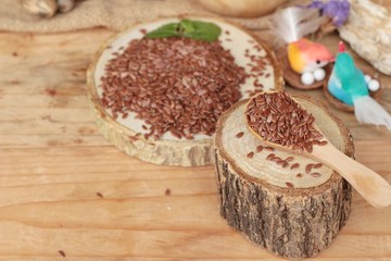 Flax seeds for health on wood background.