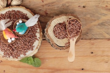 Flax seeds for health on wood background.