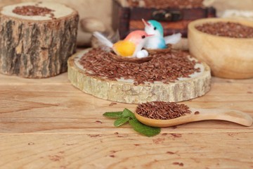 Flax seeds for health on wood background.