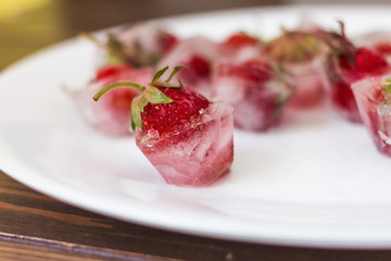 fresh strawberry  inside  in ice cube