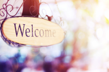 wood welcome sign hanging. selective focus © WS Films