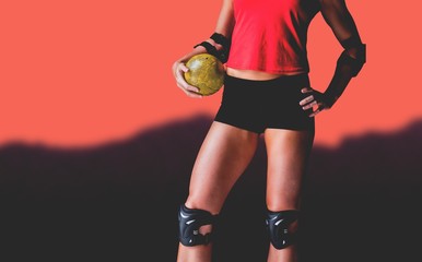 Composite image of female athlete with elbow pad holding handball