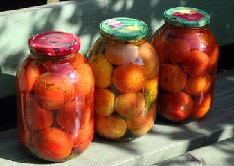 Preserved tomatoes in the glass cans