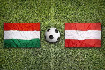 Hungary vs. Austria flags on soccer field