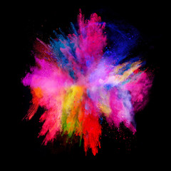 Explosion of colored powder on black background