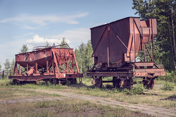 Fototapeta na wymiar Old industrial railway cars for metallurgy plant