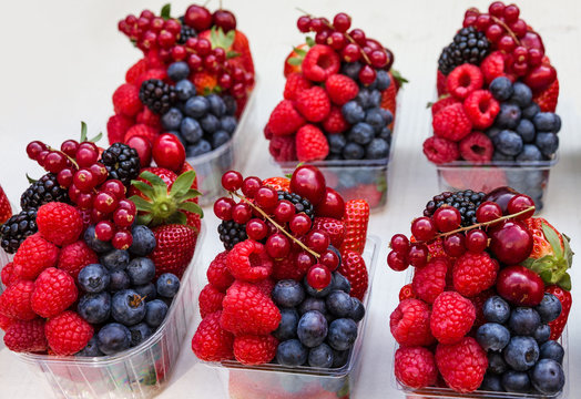 berries on the market - red currant, raspberry, blackberry