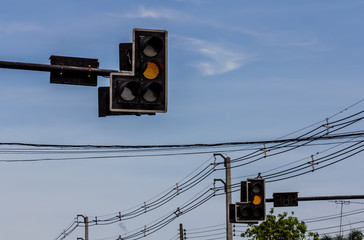 The traffic light with a beautiful blue sky in background