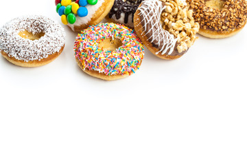 various donuts on white background