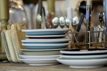 selective focus at a plate on the wooden floor, inside a coffee