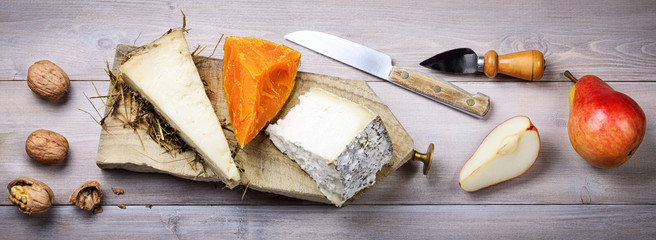 Cheese aged in hay, Mimolette cheese, Toma Brusca cheese with pears and walnuts 