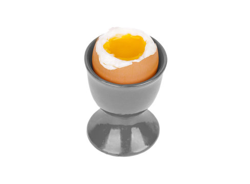 Boiled egg in a stand on an isolated background