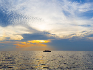 Boat silhouette with sunset sky