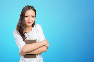 Obraz premium Woman university / college student holding book