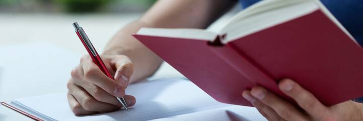 Close-up of making the notes
