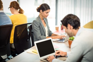 Business people working on laptop