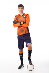soccer player with ball full length isolated on white