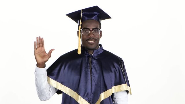 Graduate affably waving hello. White. Close up
