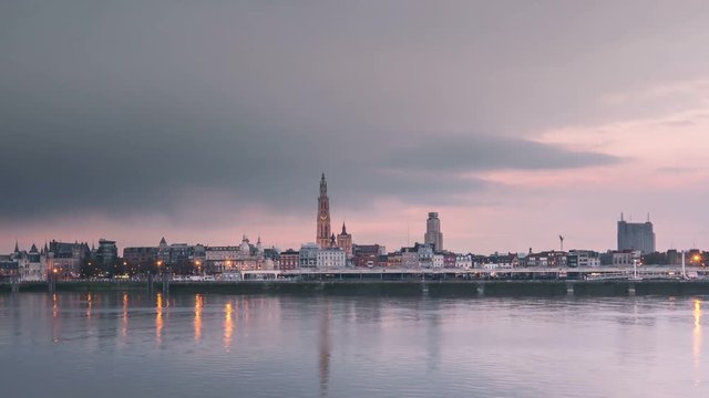 Time lapse of antwerp cityscape skyline at sunset from day to night