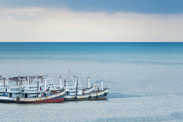 Fototapeta premium Fishing boats drop anchor at the harbor.
