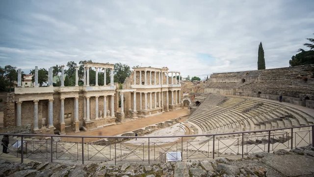 Timelapse blurred tourists and Roman Theatre in Merida