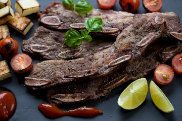 Close-up of barbecued beef short ribs, selective focus
