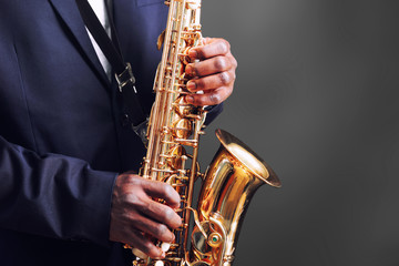 Obraz premium African American jazz musician playing the saxophone, closeup