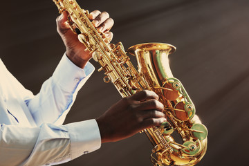 African American jazz musician playing the saxophone, closeup