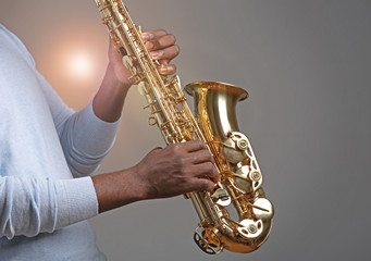 Fototapeta premium African American jazz musician playing the saxophone, closeup