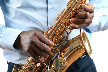 Obraz premium African American jazz musician playing the saxophone, closeup