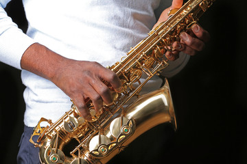 Obraz premium African American jazz musician playing the saxophone, closeup