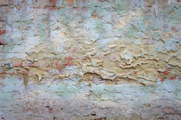 background old brick wall with remnants of plaster