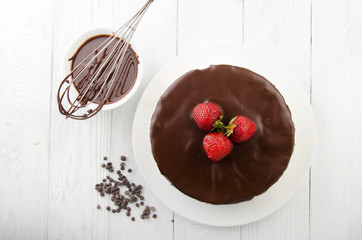 The process of making chocolate Cake filled with glaze. Top view.
