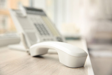 Office IP telephone on light background