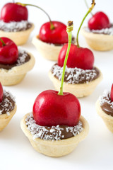 Delicious chocolate tartlets isolated on white background

