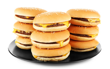 Tasty cheeseburgers on plate, isolated on white