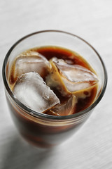 Cold coffee on wooden table