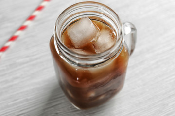 Cold coffee on wooden table