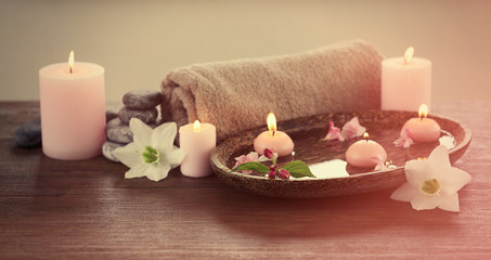 Spa composition with candles on blurred background