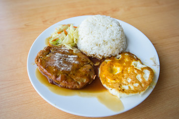 pork steak and fried egg with rice 