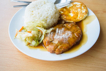 pork steak and fried egg with rice 
