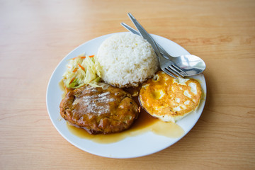 pork steak and fried egg with rice 